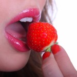 WOMAN-EATING-A-STRAWBERRY